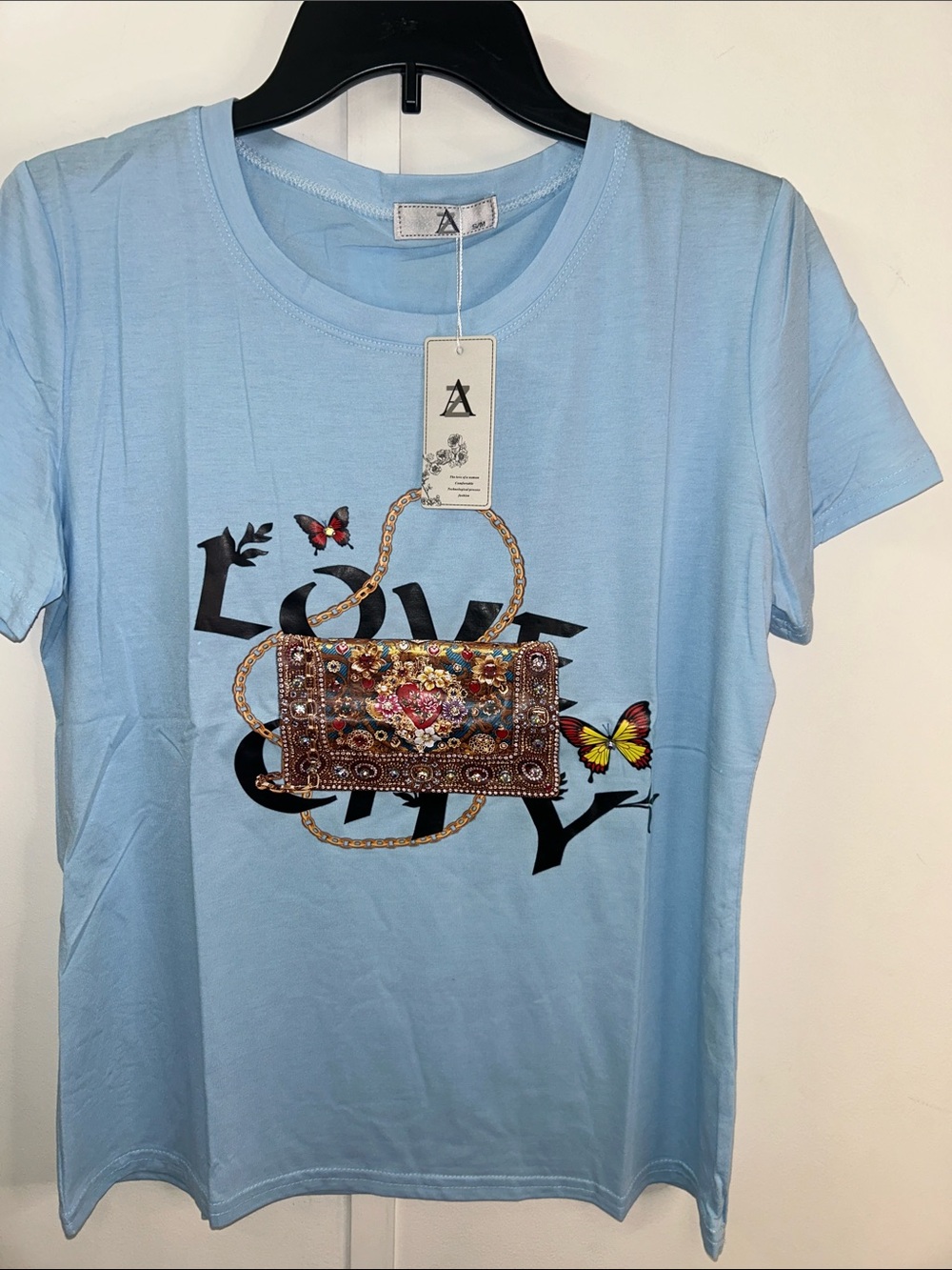 A Light Blue Women's Embellished Bag Graphic Tee